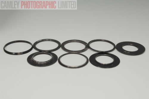Set of 8 Cokin Filter Adapters. 49 52 B50 58 67 77 88. Graded: EXC- [#10078]