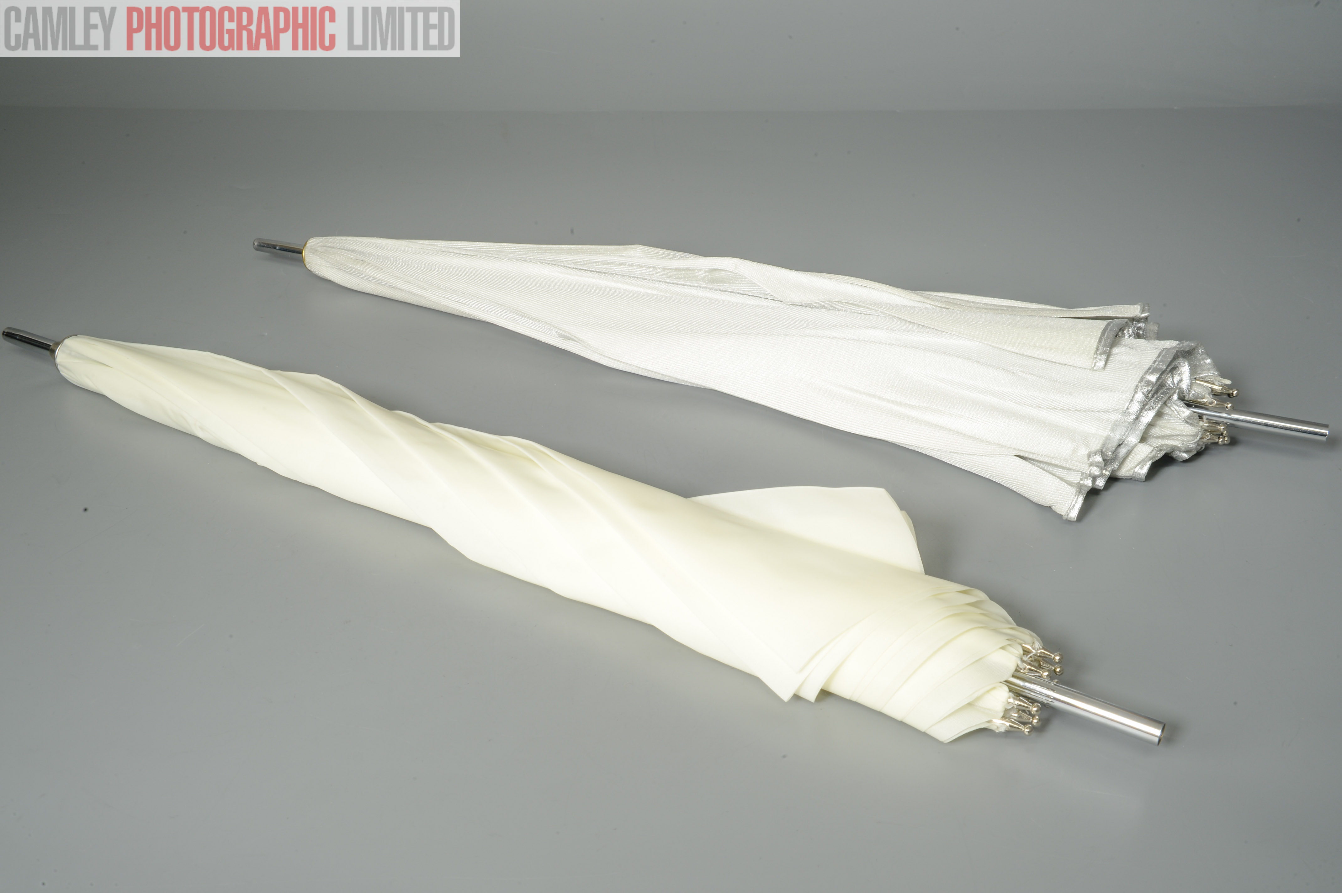 Pair of Portaflash Umbrellas: One White One Silver. Graded: EXC [#11242]